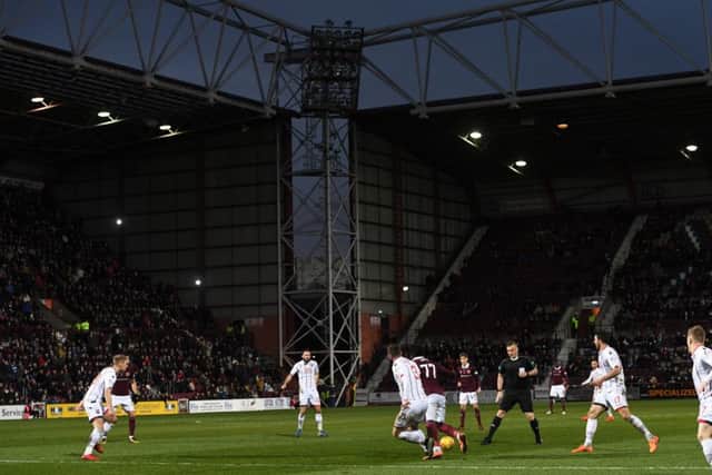 A floodlight goes out at Tynecastle Park. Picture: SNS/Craig Williamson