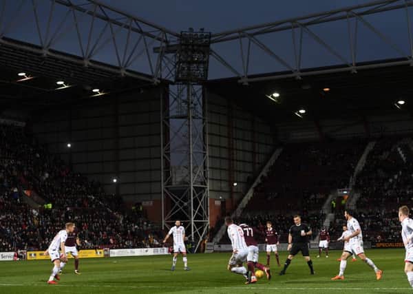 A floodlight goes out at Tynecastle Park. Picture: SNS/Craig Williamson