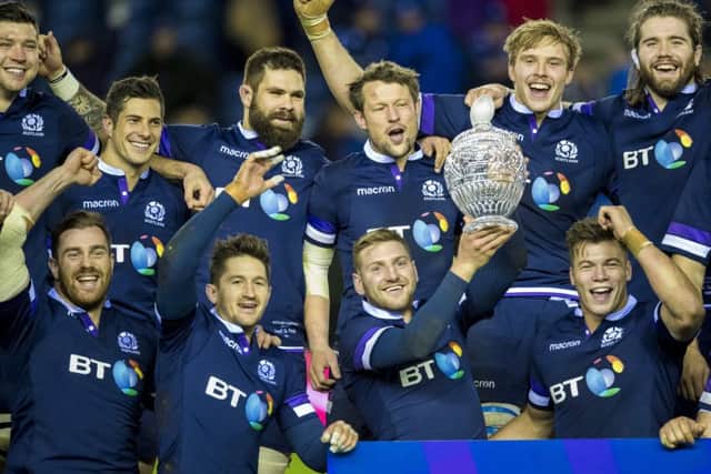 The Scotland players celebrate with the Hopetoun Cup. Picture: SNS/SRU Bill Murray