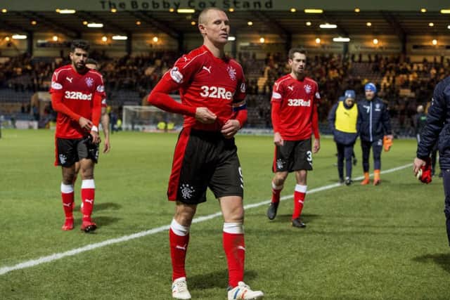 A dejected Rangers squad walk off the park after the recent 2-1 defeat to Dundee. Picture: SNS
