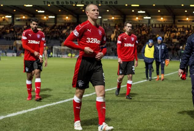 A dejected Rangers squad walk off the park after the recent 2-1 defeat to Dundee. Picture: SNS