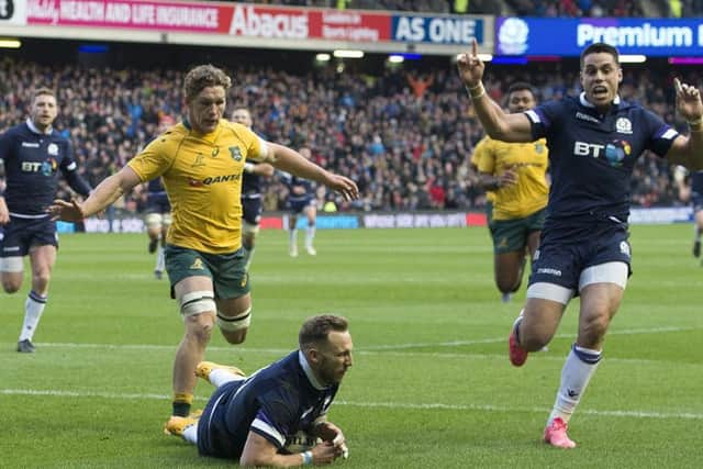 Scotland's Byron McGuigan scores the opening try against Australia. Picture: SNS