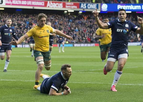 Scotland's Byron McGuigan scores the opening try against Australia. Picture: SNS