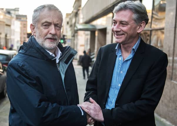 Jeremy Corbyn, left, greets new Scottish Labour leader Richard Leonard in Glasgow yesterday. Picture: John Devlin