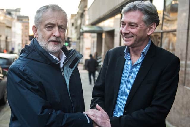 Jeremy Corbyn, left, greets new Scottish Labour leader Richard Leonard in Glasgow yesterday. Picture: John Devlin