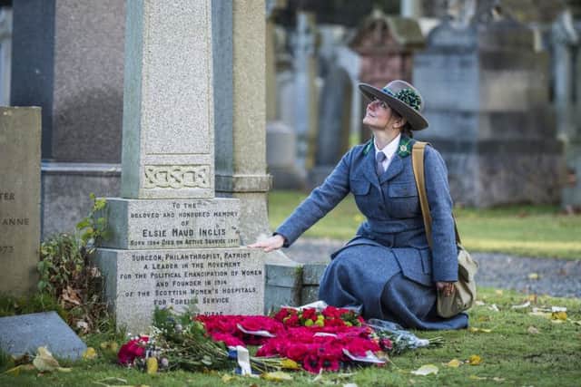 Reenactor Ailsa Clarke, dressed in a replica uniform worn by doctors in the Scottish Women's Hospitals, joins descendants of the pioneering Scottish doctor Dr Elsie Inglis at her grave at Dean Cemetery in Edinburgh to mark the centenary of her death. Picture: PA