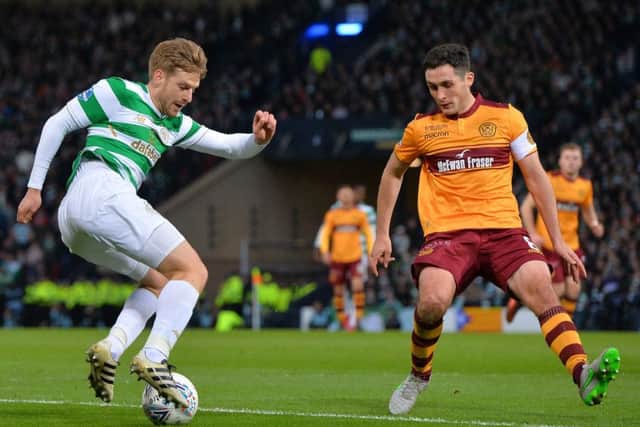 Celtic's Stuart Armstrong looks to get the better of Carl McHugh. Picture: Getty