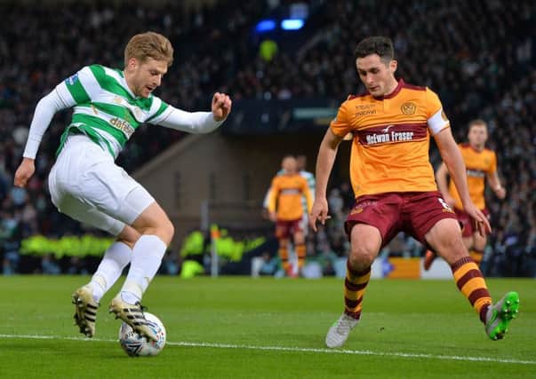 Celtic's Stuart Armstrong looks to get the better of Carl McHugh. Picture: Getty