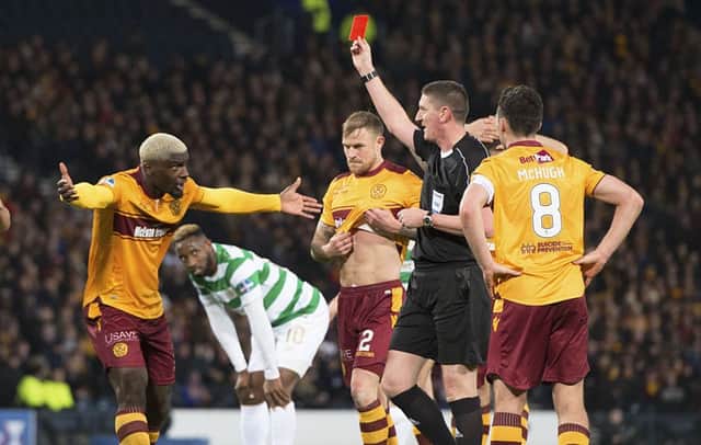 Referee Craig Thomson shows Cedric Kipre a red card. Picture: SNS