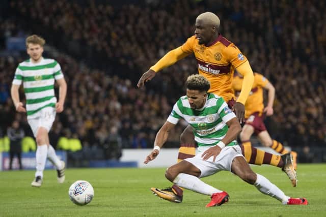 Scott Sinclair goes to ground under the attentions of Cedric Kipre. Picture: SNS