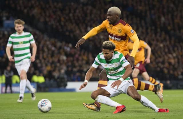 Scott Sinclair goes to ground under the attentions of Cedric Kipre. Picture: SNS