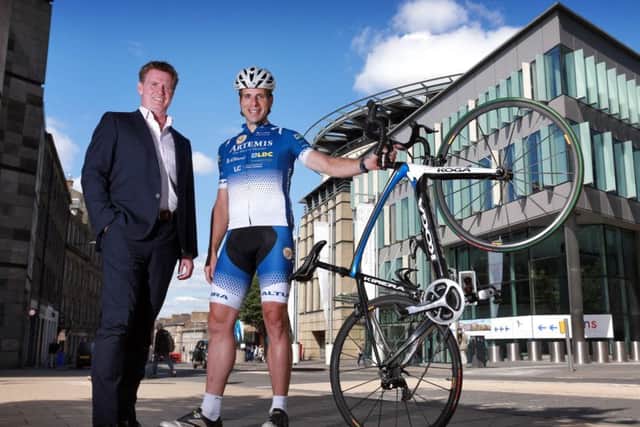 Marshall Dallas with adventure cyclist Mark Beaumont. Picture: Stewart Attwood