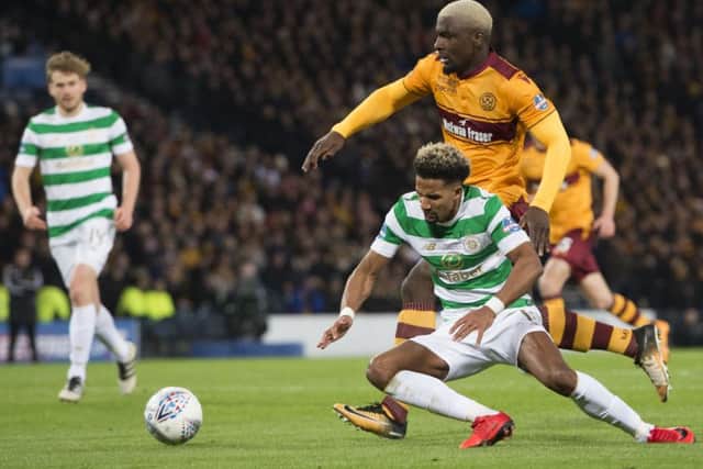 Celtic's Scott Sinclair goes to ground in the incident which saw the Parkhead side awarded a penalty and Motherwell's Cedric Kipre sent off. Picture: Ross Parker/SNS