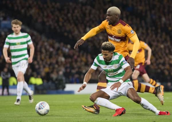Celtic's Scott Sinclair goes to ground in the incident which saw the Parkhead side awarded a penalty and Motherwell's Cedric Kipre sent off. Picture: Ross Parker/SNS