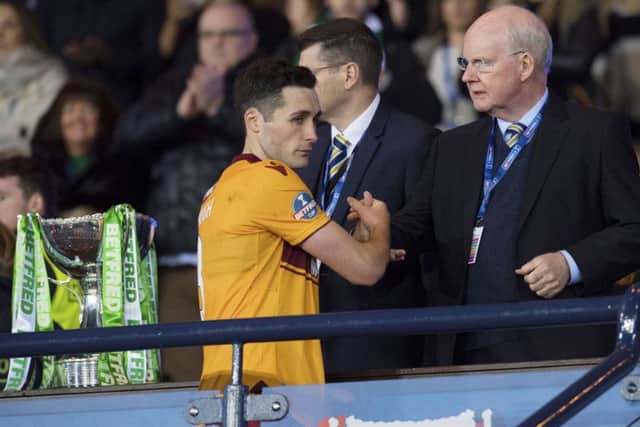 Motherwell's Carl McHugh receives his runners-up medal at Hampden. Picture: Craig Foy/SNS