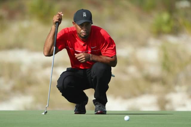 Tiger Woods lines up a putt in last years World Hero Challenge, in which he will make his latest comeback. Picture: Christian Petersen/Getty Images