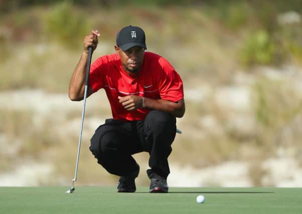Tiger Woods lines up a putt in last years World Hero Challenge, in which he will make his latest comeback. Picture: Christian Petersen/Getty Images