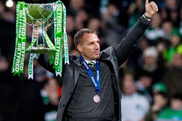 Celtic manager Brendan Rodgers shows off the League Cup to the fans. Picture: Ross Parker/SNS