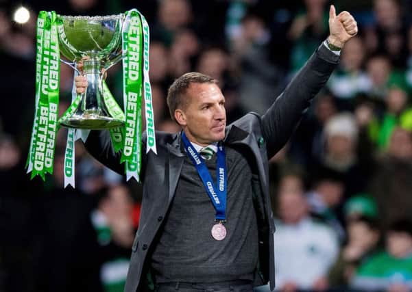 Celtic manager Brendan Rodgers shows off the League Cup to the fans. Picture: Ross Parker/SNS