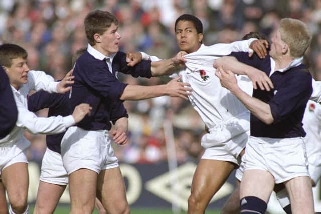 Jeremy Guscott gets to grips with Tony Stanger during Scotland's 13-7 victory over England at Murrayfield in 1990. Picture: Getty Images
