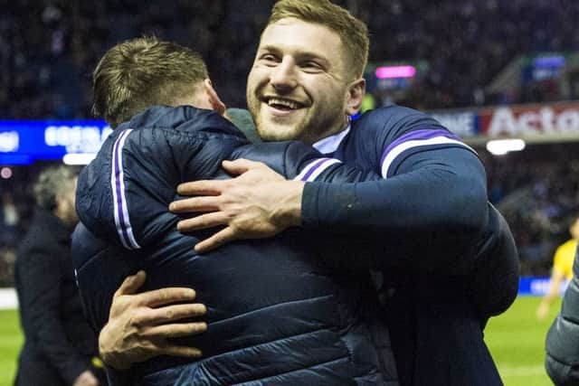 Finn Russell, right, embraces injured team-mate Stuart Hogg at full-time. Picture: Paul Devlin/SNS