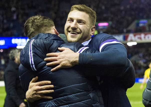 Finn Russell, right, embraces injured team-mate Stuart Hogg at full-time. Picture: Paul Devlin/SNS
