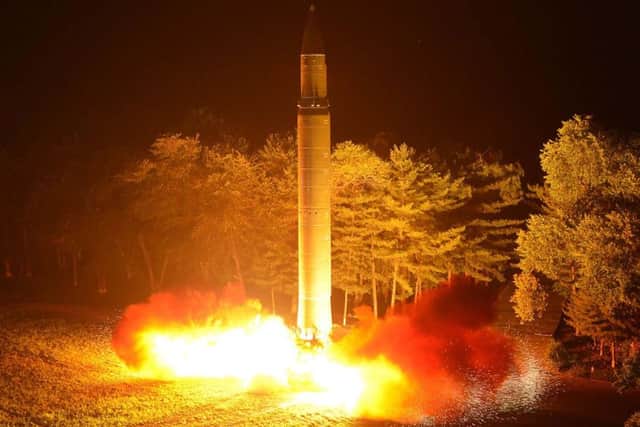 North Korea's Hwasong intercontinental ballistic missile is lauched at an undisclosed location. Picture: AFP/KCNA VIS KNS.