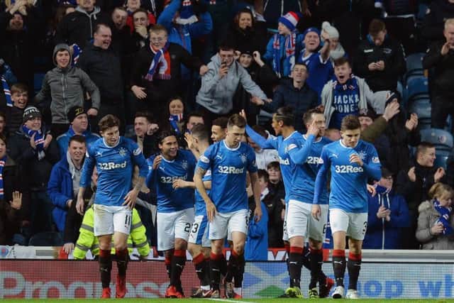 Rangers players celebrate after Carlos Pena doubles their lead. Picture: PA