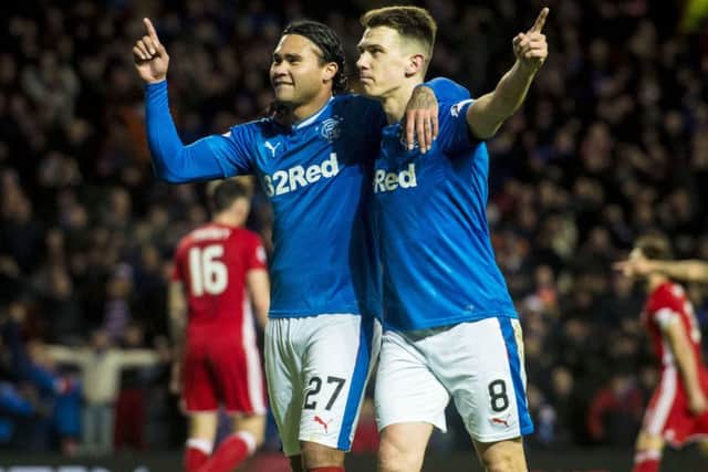 Ryan Jack, right, celebrates with Carlos Pena after the latter doubled Rangers' advantage. Picture: SNS