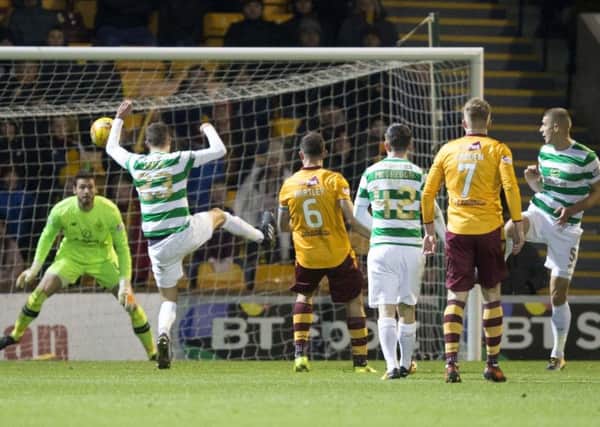 Celtic's Mikael Lustig knocks the ball into the back of his own net. Picture: PA