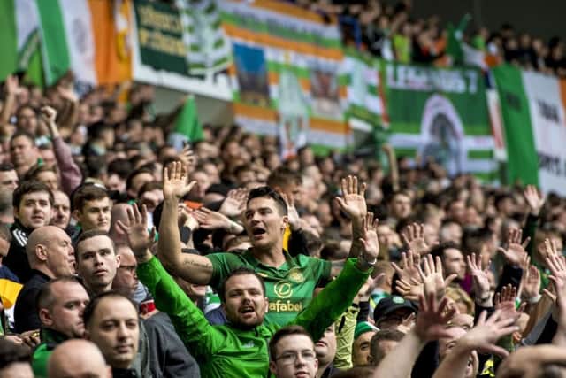 Celtic fans in the Broomloan Stand at Ibrox. Picture: SNS