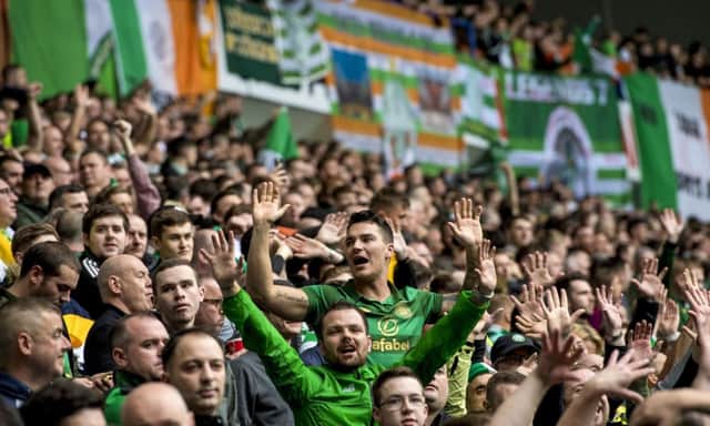 Celtic fans in the Broomloan Stand at Ibrox. Picture: SNS