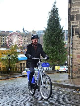 The Scotsman transport correspondent Alastair Dalton finds an electric bike makes Edinburgh's steep streets easy pedalling. Picture: Jon Savage