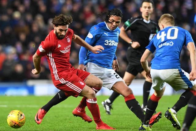 Aberdeen's Graeme Shinnie in action against Rangers' Carlos Pena. Picture: Alan Harvey/SNS