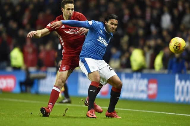 Pena holds off Andy Considine during the Ibrox side's 3-0 win over Aberdeen. Picture: SNS Group