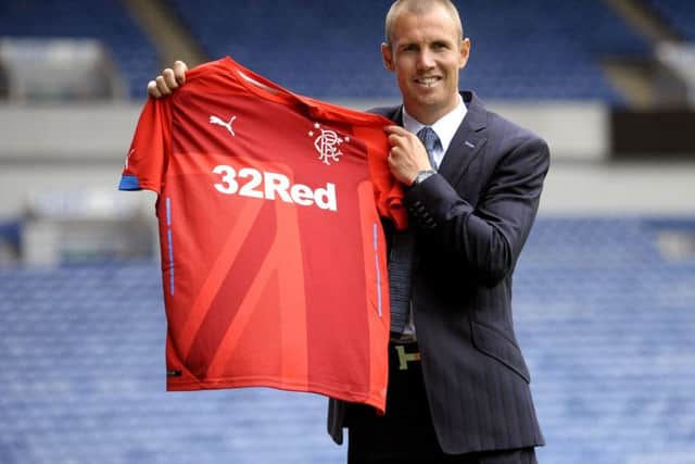 Kenny Miller poses with a Puma-made Rangers shirt. The Ibrox club have started work on a new kit supplier deal. Picture: John Devlin