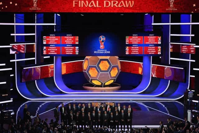 A general view as the national team managers pose for a photo on the stage after the Final Draw. Picture: Getty Images