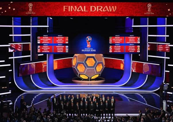 A general view as the national team managers pose for a photo on the stage after the Final Draw. Picture: Getty Images