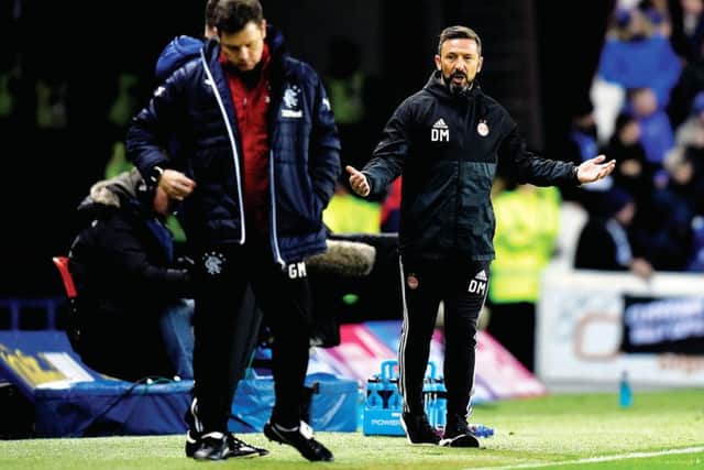 Aberdeen manager Derek McInnes on the touchline with Rangers' Graeme Murty during Wednesday's match at Ibrox. Picture: Rob Casey/SNS