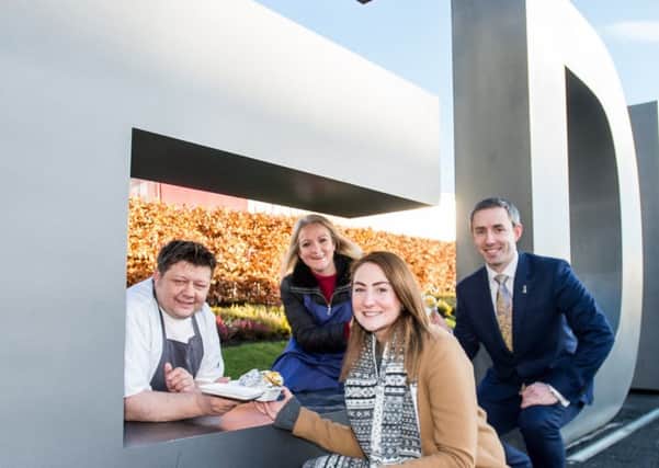 Thousands are taking part in the event. Mark Greenaway and Clare MacDougall, trade marketing manager at Seafood Scotland serve Alice Thompson, co-founder of Social Bite, and Rob Laing of Edinburgh Airport

. Picture: Wullie Marr Photography