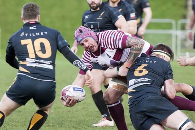 Watsonian's Craig Borthwick is tackled by Stephen Ainslie. Picture: Alistair Linford