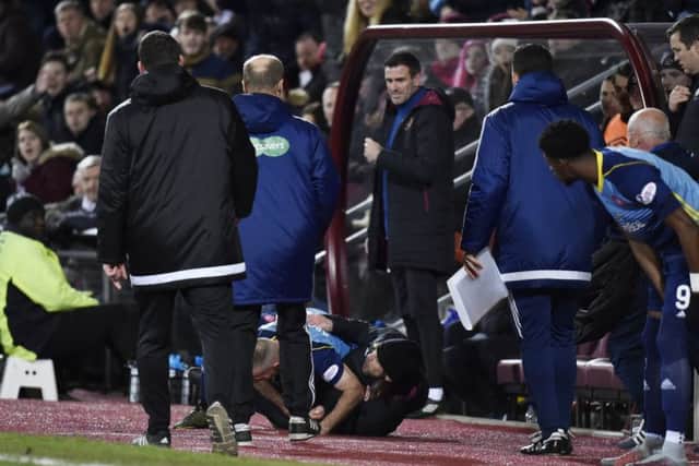 Hearts Assistant Manager Austin McPhee and Darian McKinnon battle in the dugout. Picture: SNS/Rob Casey