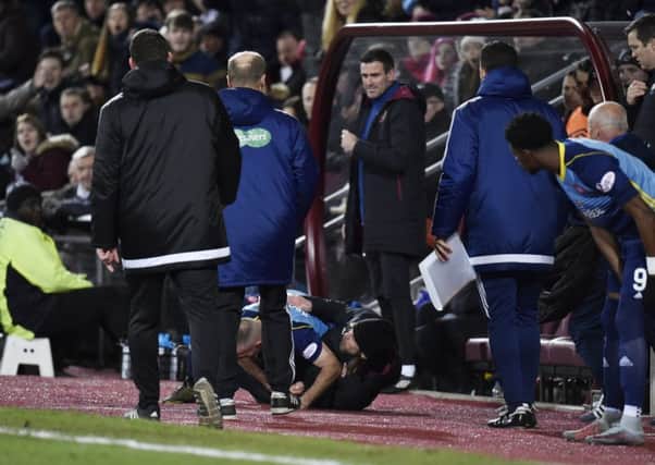 Hearts Assistant Manager Austin McPhee and Darian McKinnon battle in the dugout. Picture: SNS/Rob Casey
