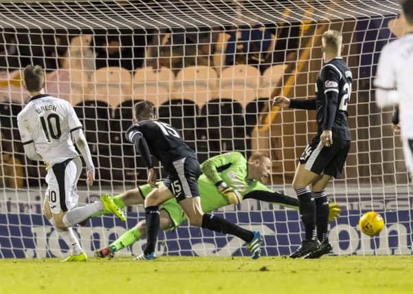 Dumbarton's Tom Walsh scores to make it 1-0. Picture: SNS/Roddy Scott