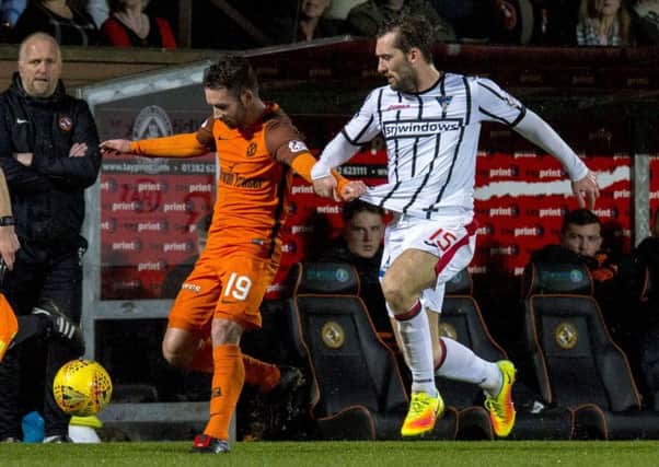 Dundee Utd's James Keatings (L) in action against Michael Paton. Picture: SNS/Sammy Turner