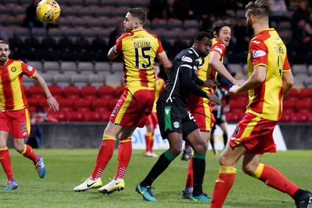 Partick Thistle's Adam Barton scores an own goal which give Hibernian their victory. Picture: SNS.