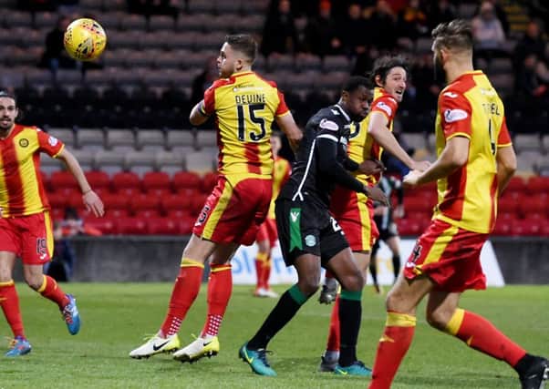 Partick Thistle's Adam Barton scores an own goal which give Hibernian their victory. Picture: SNS.