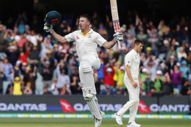 Australia batsman Shaun Marsh jumps for joy after reaching his century. Picture: Jason O'Brien/PA