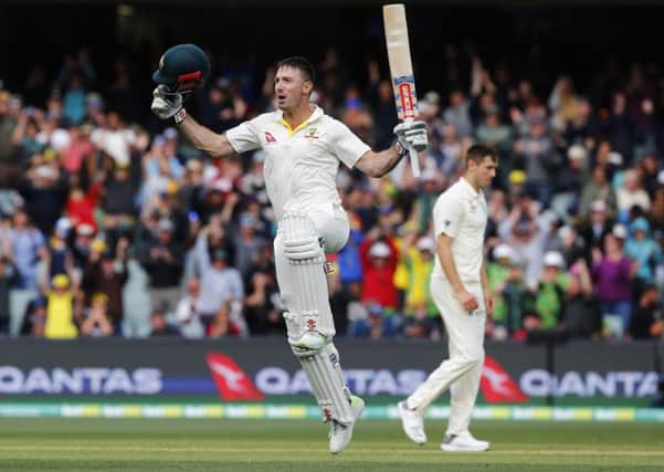 Australia batsman Shaun Marsh jumps for joy after reaching his century. Picture: Jason O'Brien/PA