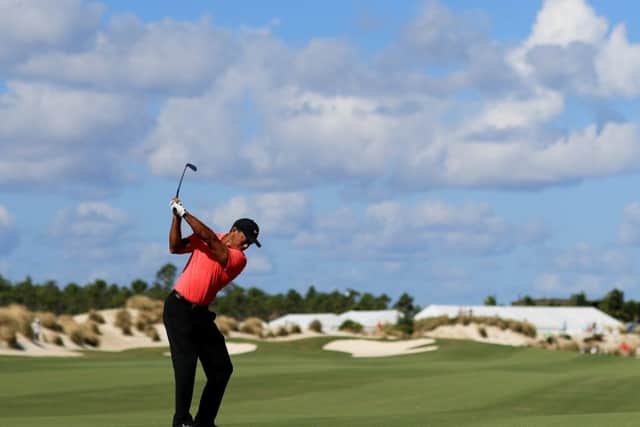 Tiger Woods plays a shot on the third hole en route to a closing four-under 68 on his return to action in the Hero World Challenge in the Bahamas. Picture: Getty Images